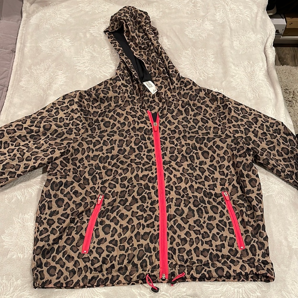 Athletic collection rain jacket. Size medium. Animal print with pink zippers.